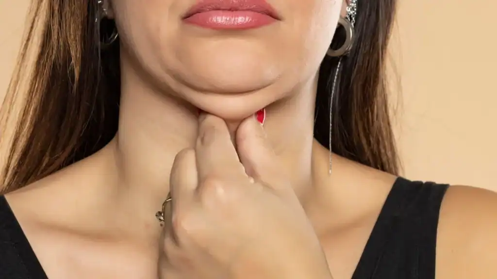 An image of a woman with double chin, sad, worried : Non Surgical Double Chin Removal Treatment in Kings Norton, UK